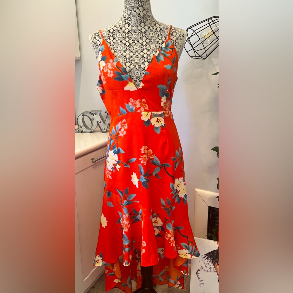 Bright and beautiful high-low summer dress with adjustable straps & lining.